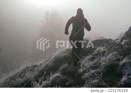 Trail Runner in Misty Mountain Landscape 123176359