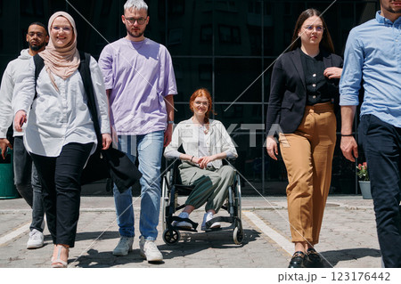 A diverse and confident group of businessmen posing together, with a businesswoman in a wheelchair radiating success, ambition, and unity, capturing the essence of a dynamic and inspiring business A diverse and confident group of businessmen posing together, with a businesswoman in a wheelchair radiating success, ambition, and unity, capturing the essence of a dynamic and inspiring business 123176442