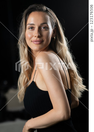 Radiant Elegance: A Stunning Blonde in a Black Dress Exuding Confidence and Beauty. Radiant Elegance: A Stunning Blonde in a Black Dress Exuding Confidence and Beauty. 123176506