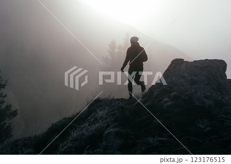 Trail Runner in Misty Mountain Landscape 123176515