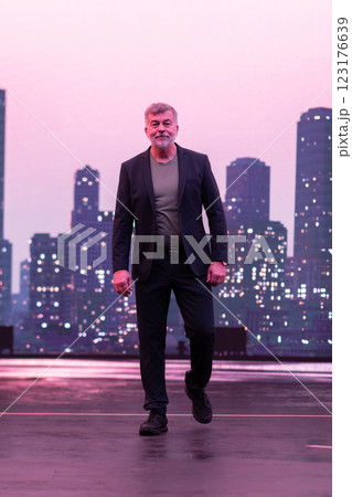 Confident Gentleman Walking in an Urban Evening Cityscape. 123176639