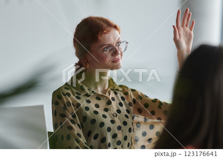 A diverse multiethnic business team engages in a collaborative meeting, discussing strategies and solutions in a modern office setting 123176641