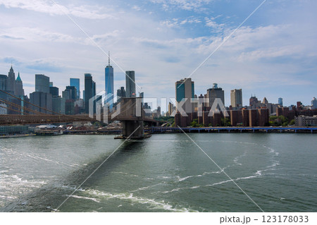 Brooklyn Bridge spans East River with backdrop of Manhattan skyline at NYC America Brooklyn Bridge spans East River with backdrop of Manhattan skyline at NYC America 123178033