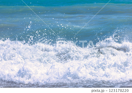 Nerja town, a resort of The Costa del Sol seaside region in Andalusia in the south of Spain. Ocean waves crashing on the shore, creating a frothy whitecap. 123178220