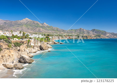 Nerja town, a resort of The Costa del Sol seaside region in Andalusia in the south of Spain, view from the Balcon de Europa square. Stunning coastal view with turquoise water. Nerja town, a resort of The Costa del Sol seaside region in Andalusia in the south of Spain, view from the Balcon de Europa square. Stunning coastal view with turquoise water. 123178225