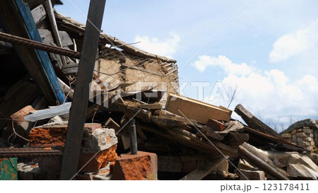 View to destroyed residential buildings at Kharkivska oblast. Ruined houses after bomb attacks on ukrainian territory from russia army. Consequences of russian invasion of Ukraine. Slow motion 123178411