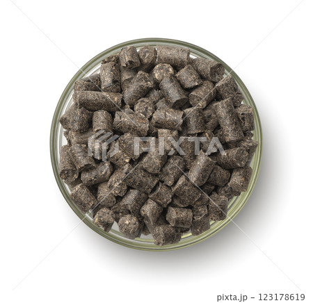 Sunflower press cake pellets in glass bowl 123178619