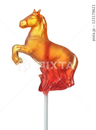 Side view of orange sugar lollipop horse 123178621