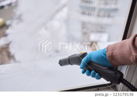 Efficient Steam Cleaning of Windows Utilizing Specialized Professional Equipment and Tools 123179136