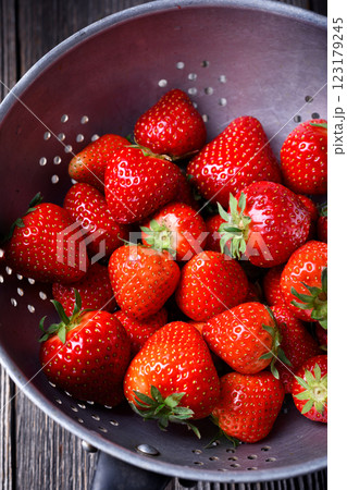 Just washed fresh ripe red strawberry in metal colander Just washed fresh ripe red strawberry in metal colander 123179245