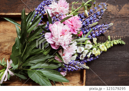 A bouquet of lupines and peonies A bouquet of lupines and peonies 123179295