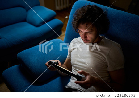 Enjoy an exciting gaming session with a handheld console full of thrills and adventures 123180573