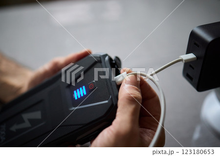 Charging a portable power bank using a USB cable is a convenient and essential process Charging a portable power bank using a USB cable is a convenient and essential process 123180653