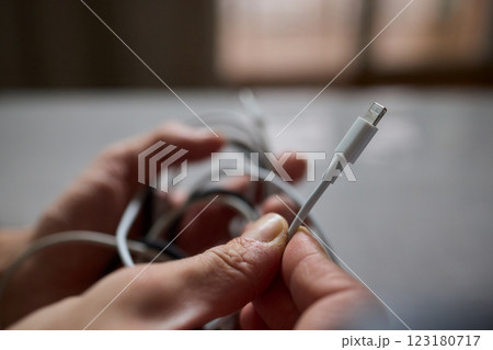 Tangled Cords in Hand The Everyday Clutter and Chaos of Our Modern Technology Life Tangled Cords in Hand The Everyday Clutter and Chaos of Our Modern Technology Life 123180717