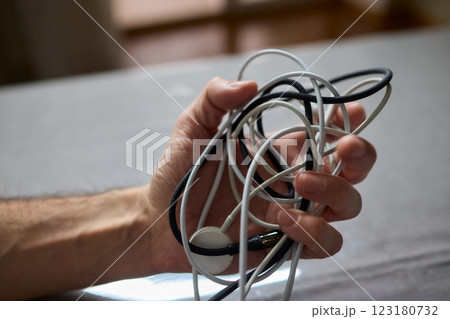 Tangled Cords in Hand The Everyday Clutter and Chaos of Our Modern Technology Life 123180732