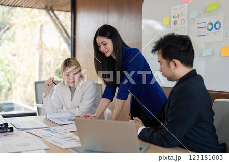 Business team collaborating on project analysis and data presentation during a meeting, focusing on insights and strategic planning. 123181603