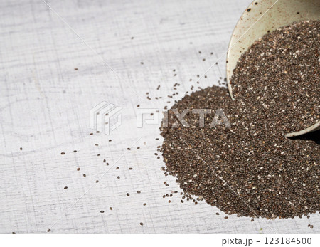 Chia seeds in bowl on wood board. Chia seeds in bowl on wood board. 123184500