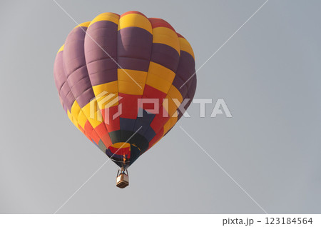 Hot air balloon in flight against the sky. Hot air balloon in flight against the sky. 123184564