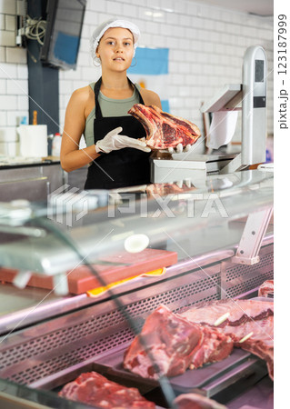 saleswoman expertly showcases selection saleswoman expertly showcases selection 123187999