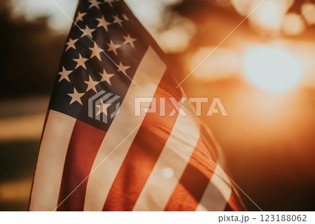 Beautiful USA Flag Flutters Gracefully in the Gentle Wind During a Sunset Glow 123188062