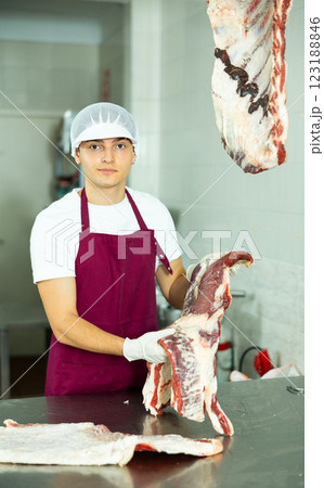 man behind counter prepares man behind counter prepares 123188846