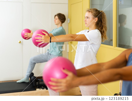 Teenagers training pilates in gym 123189215