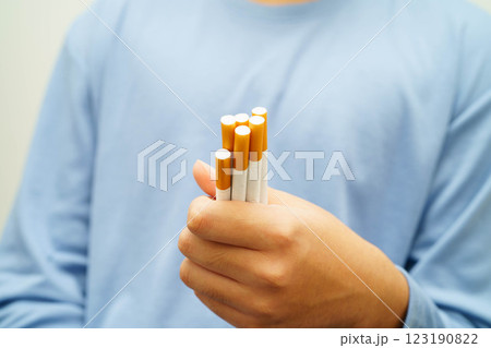 Asian man holding cigarette, no smoking. Asian man holding cigarette, no smoking. 123190822