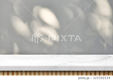 Empty Japandi Marble Table with Natural Light and Bokeh on Stucco Wall Texture Background Empty Japandi Marble Table with Natural Light and Bokeh on Stucco Wall Texture Background 123191514