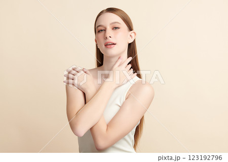 Beautiful young woman with clean fresh skin on beige background, Face care, Facial treatment, Cosmetology, beauty and spa, women portrait. 123192796