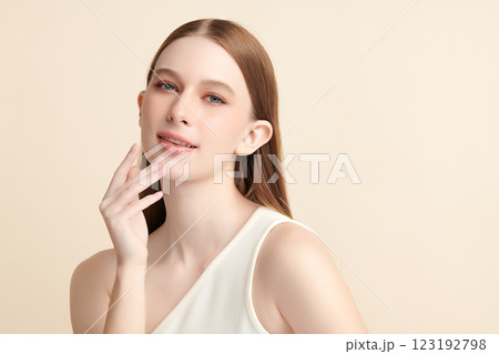 Beautiful young woman with clean fresh skin on beige background, Face care, Facial treatment, Cosmetology, beauty and spa, women portrait. 123192798