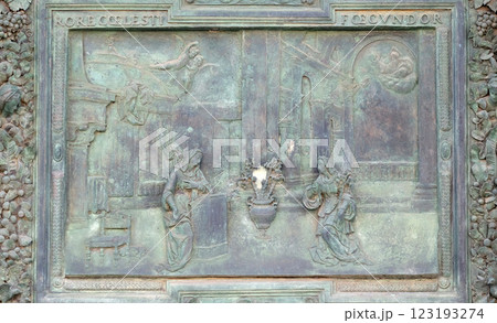 The Annunciation of the Virgin Mary, detail of the central door of the Cathedral St. Mary of the Assumption in Pisa, Italy 123193274