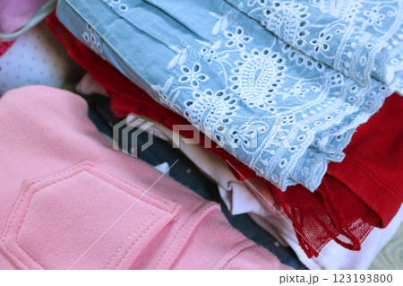 Baby blue vintage style embroidered dress and pink pants. Cleaning and recycling. Ecology and recycling. Baby blue vintage style embroidered dress and pink pants. Cleaning and recycling. Ecology and recycling. 123193800