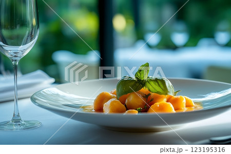 Delicious Pumpkin Gnocchi with Basil, Elegant Restaurant Dish herb pasta green lunch orange yellow 123195316