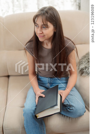 Bible, woman study and writing, notes on religion at desk in home, Christian faith and knowledge of God. Reading, hope and girl holy book, learning gospel inspiration prayer. 123196089