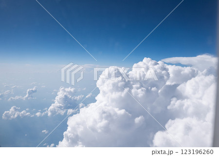 View from window of the plane above expanse of fluffy white clouds View from window of the plane above expanse of fluffy white clouds 123196260