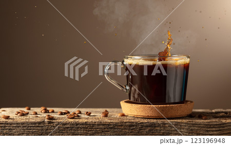 Black coffee in glass cup on a brown background. 123196948