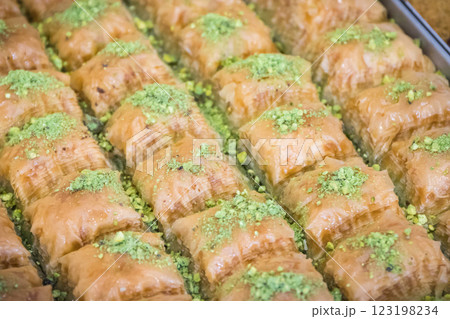 Turkisch baklava. Sweet pastry made of layers filo dough with pistachio, nuts and honey Turkisch baklava. Sweet pastry made of layers filo dough with pistachio, nuts and honey 123198234