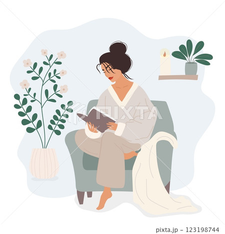 Woman reading a book in a cozy chair, self-care concept Woman reading a book in a cozy chair, self-care concept 123198744