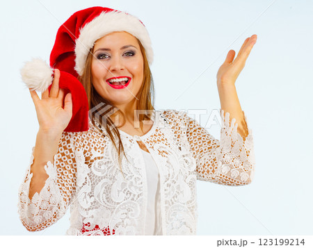 Excited woman in christmas santa hat Excited woman in christmas santa hat 123199214