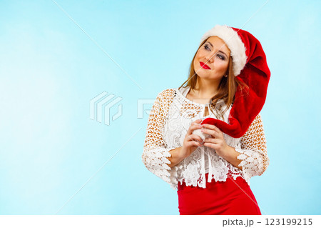 Smiling woman in christmas santa hat 123199215