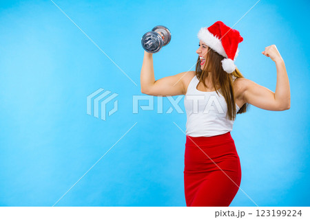 Santa claus woman lifting dumbbells 123199224