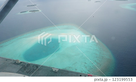 Flying over tropical atoll in maldives archipelago 123199553