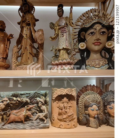 Bunch of handmade wood crafted souvenirs figurines of Balinese traditional style Bunch of handmade wood crafted souvenirs figurines of Balinese traditional style 123199907