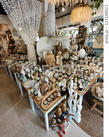 Rattan round table mats decorated with shells and rattan bottle holders at a street shop. Bali, Indonesia. Rattan round table mats decorated with shells and rattan bottle holders at a street shop. Bali, Indonesia. 123199921