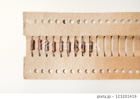 Brown resistor in a paper package. The electronic component. 123201419