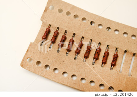 Brown resistor in a paper package. The electronic component. 123201420