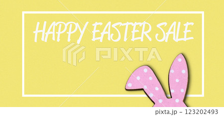 Yellow background with a pink rabbit on it 123202493