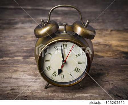 Alarm Clock on wooden background Alarm Clock on wooden background 123203531