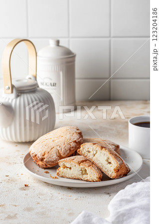 Sochniki (sochni) with cottage cheese. Shortbread cookies with cottage cheese on white kitchen table background. Tea time Sochniki (sochni) with cottage cheese. Shortbread cookies with cottage cheese on white kitchen table background. Tea time 123204186