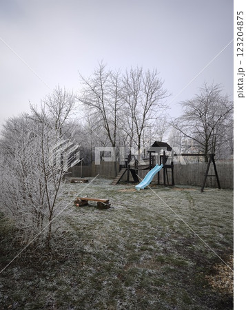 Playground covered in frost on a cold december morning in prague Nature park Smetanka 123204875